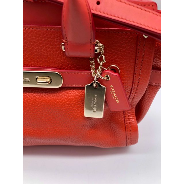 coral coach bolsa