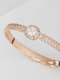 bracelete-click-texturizado-com-zirconia-central-folheado-em-ouro-18k-01-francisca